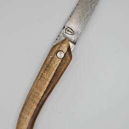 Couteau pliant à friction