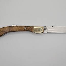 Pliant artisanal à pompe en loupe d'acacia