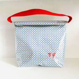 Lunch bag enduit blanc à motifs bleus