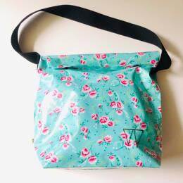 Lunch bag enduit bleu à motifs roses