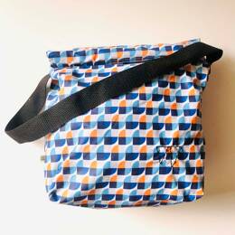 Lunch bag enduit bleu et orange à motifs graphiques
